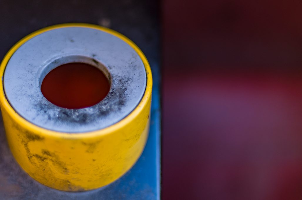 Urban close-up of an ashtray built into a public dustbin.