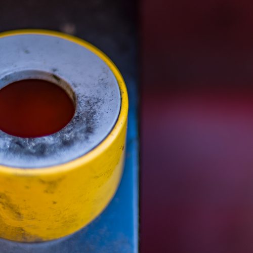 Urban close-up of an ashtray built into a public dustbin.