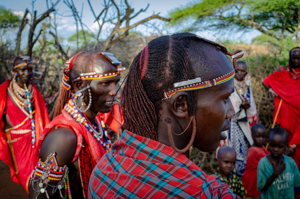 Portrait of a traditionally dressed group of Masai warriors in their village.