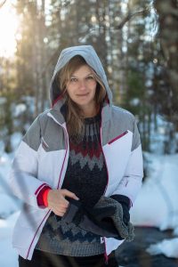 Portrait shot of a woman in winter clothes.