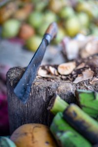 Urban shot of a machete on the fruit stand.
