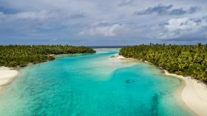 Aerial view of a channel between two tropical islands.