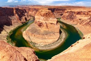 Landscape shot of a river that meanders deeply through the rocky landscape.