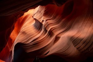 Landscape shot of a red sandstone crevice in Antelope Canyon.