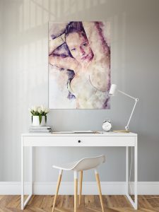 Photo of a desk with a painting above.