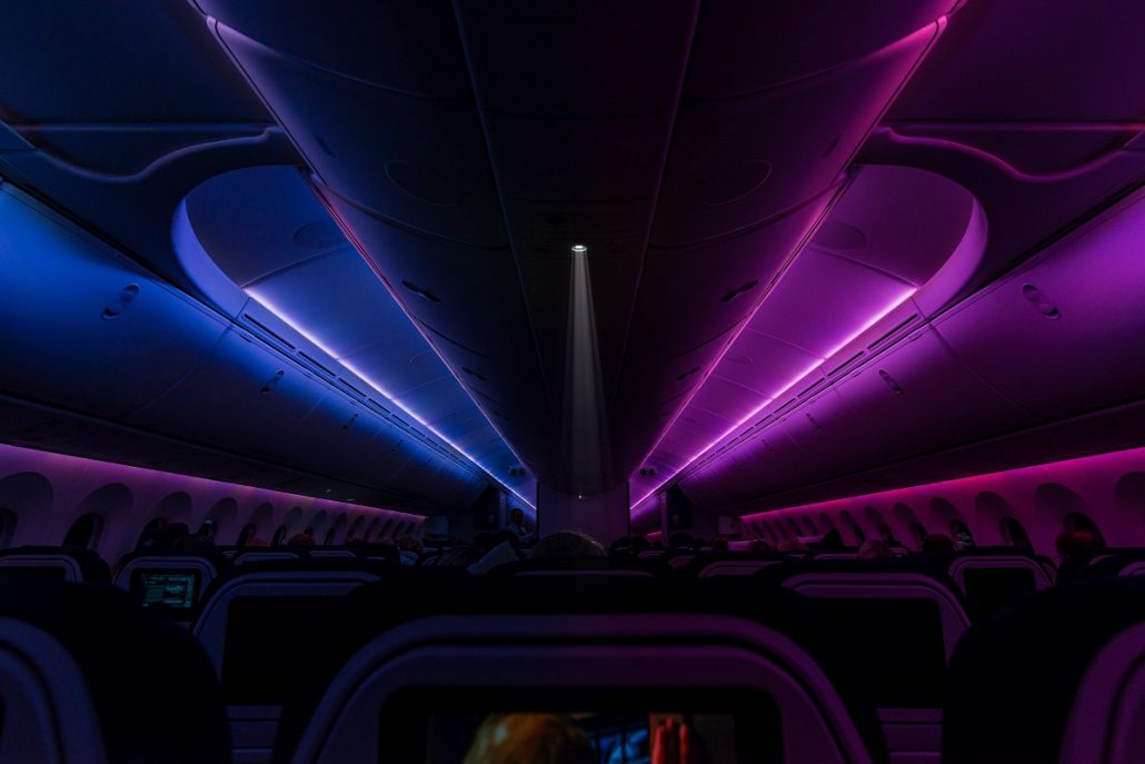 Night photography of an airplane interior.