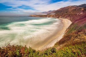 Landscape shot of a bay with pebble beach.