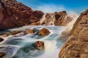 Landscape shot of a rock formation on the coast.