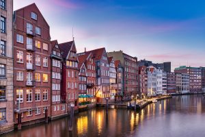 Night shot of old brick houses on a canal.