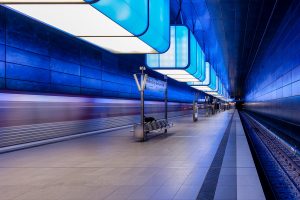 Night photography of a subway station with blue lights.