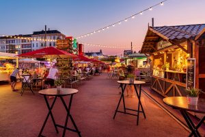 Night shot of a wine festival with many small stalls.