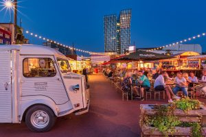Night shot of a wine festival with many small stalls.
