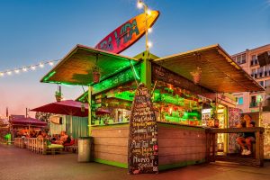 Night photography of a green glowing bar.