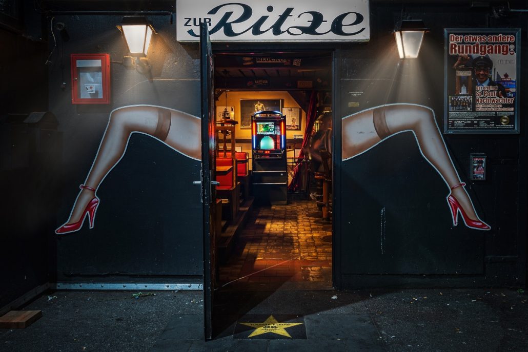 Night photograph of a pub entrance door.