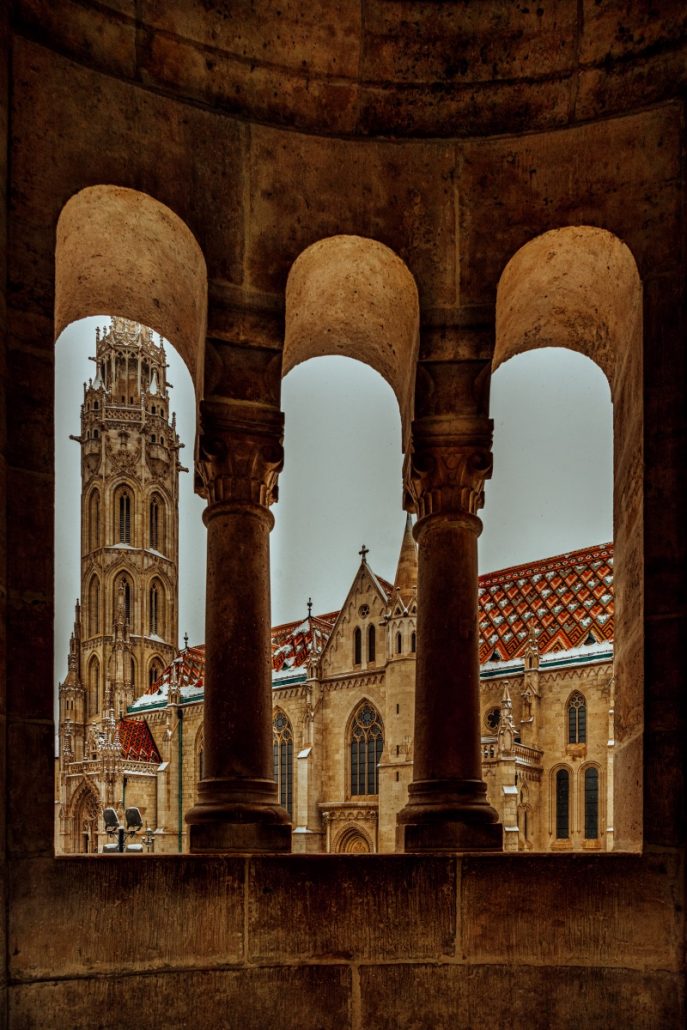 Architecture photograph of the Matthias church through three arches.