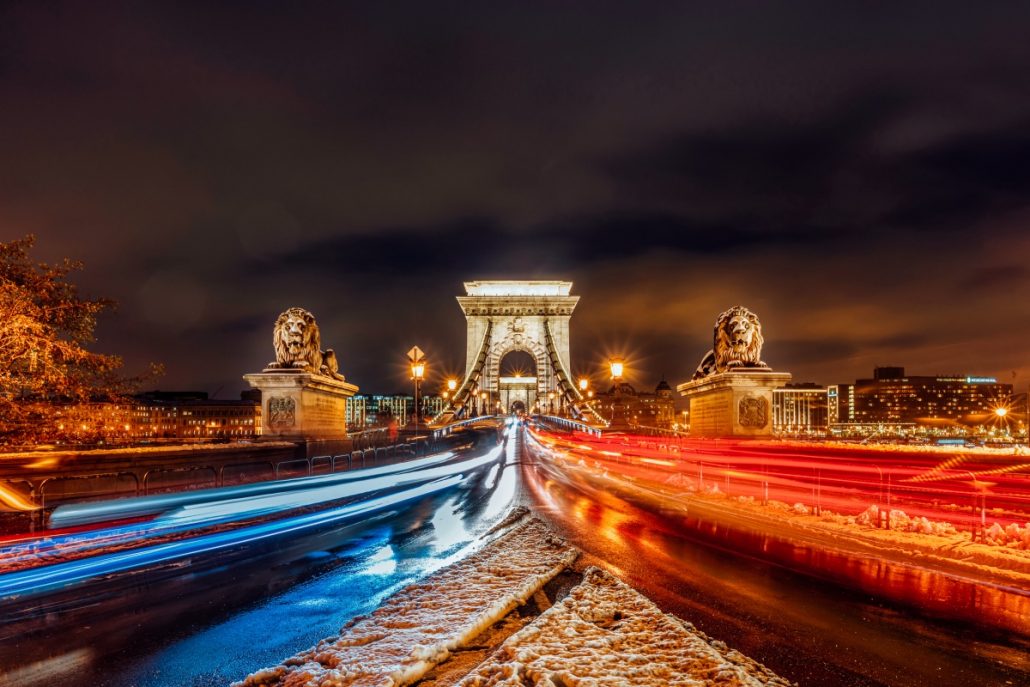 Night shot of the lions on the Budapest chain bridge.
