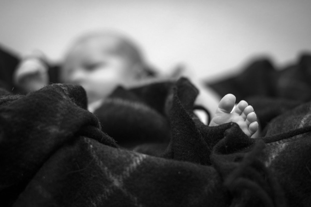 Black and white photo of a baby foot.