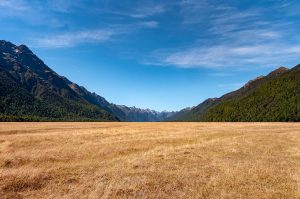 Landscape shot of a valley surrounded by mountains.