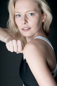Portrait photo of a strong, young woman.